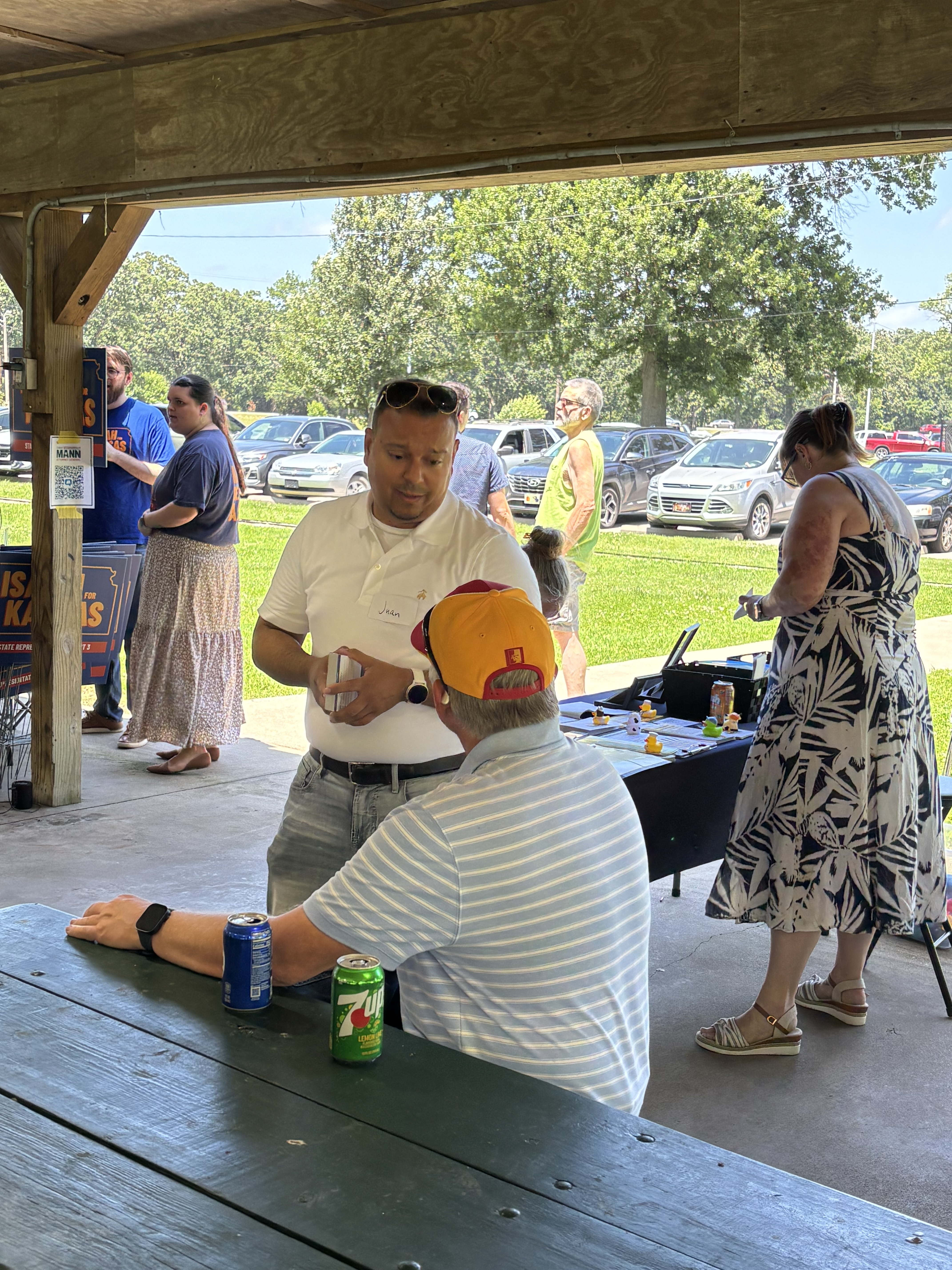 Juan speaking to a constituent about small business.