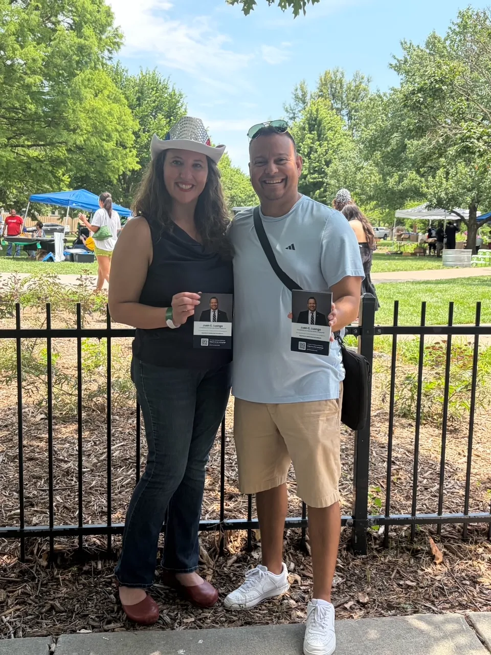 Juan C. Luengo with a community member at a Juneteenth celebration in a Lawrence park.