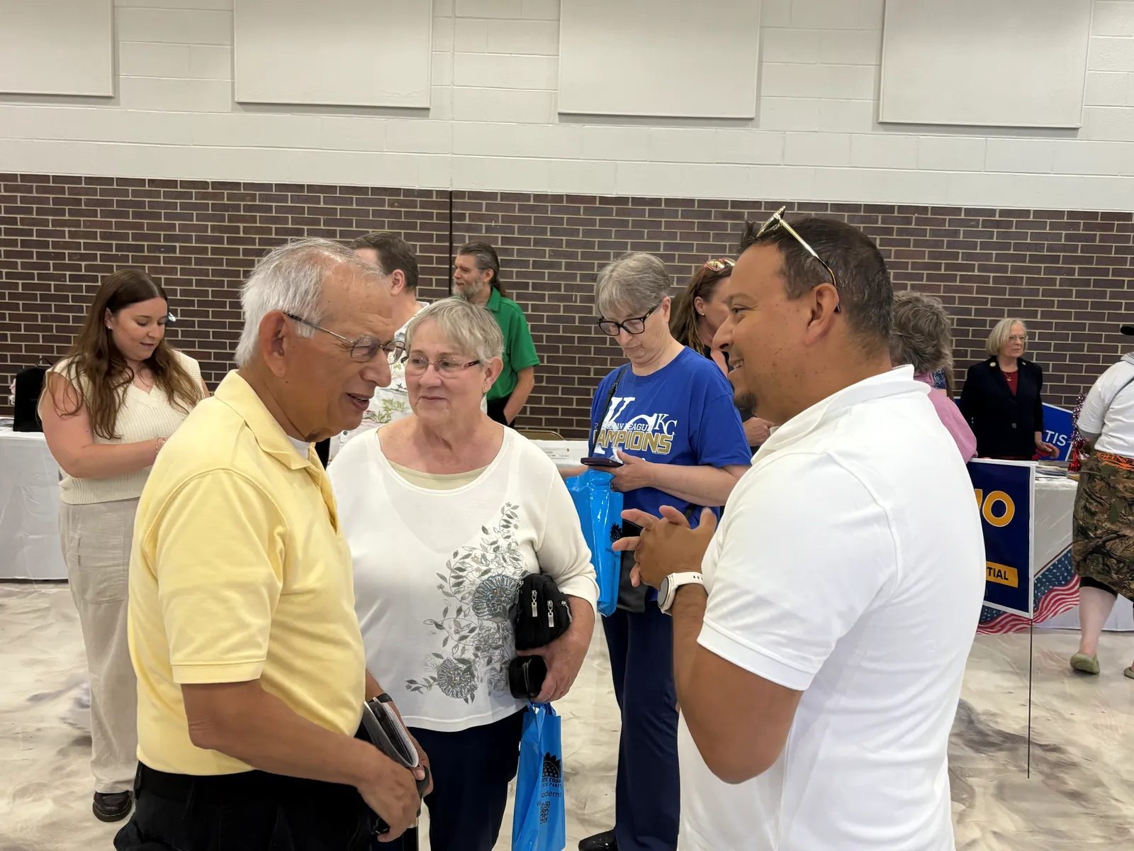 Juan C. Luengo listens to community members at a gathering in Wyandotte County.